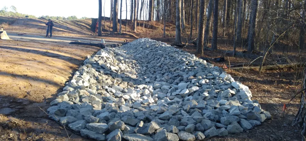 Stone reinforcement along the drainage channel