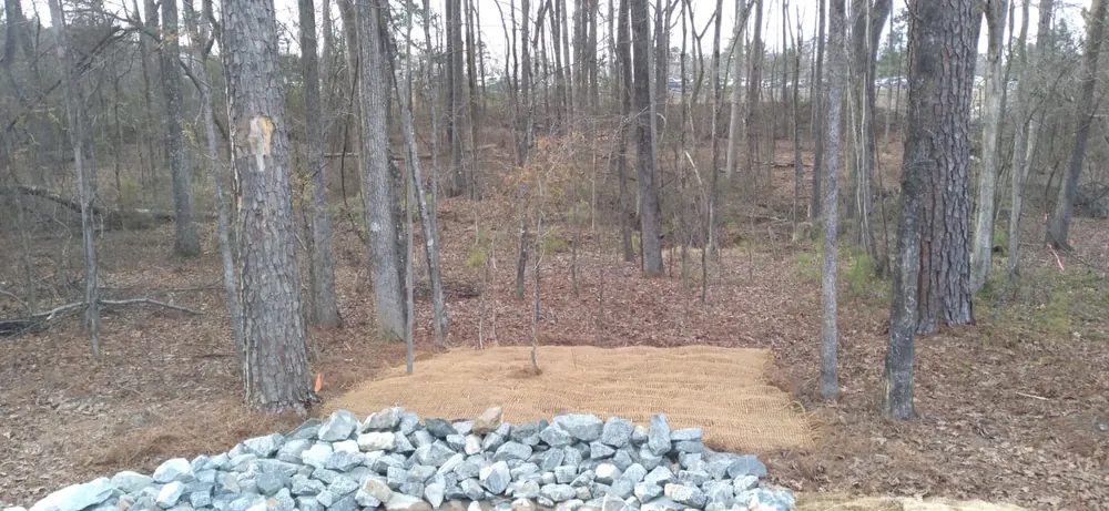 Completed berm and drainage system with stabilized surface