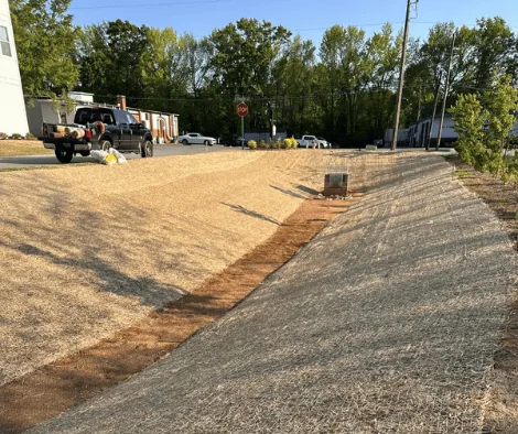 Matting and drainage channel on the pond conversion site