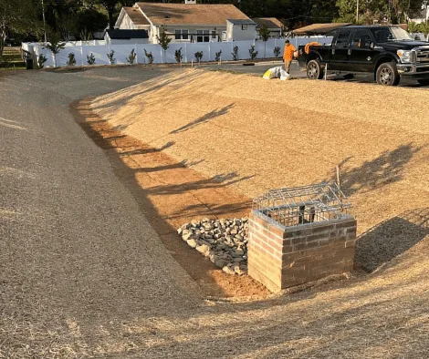 Team installing double net matting on a pond conversion project