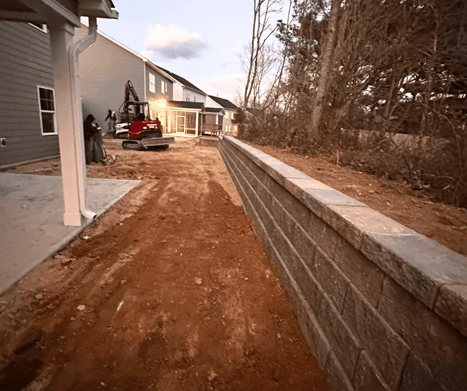 Retaining wall with French drain under construction